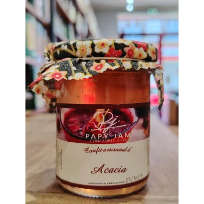 Savourez la gelée artisanale Papy Jam d'acacia, un délice printanier au parfum de miel, rappelant les douceurs des cours d'école.